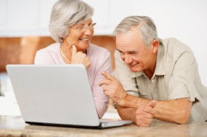 Senior-man-and-woman-using-a-computer-laptop